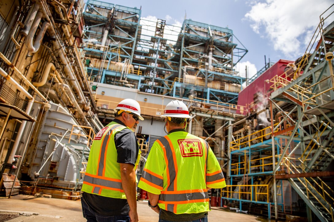 U.S. Army Corps of Engineers, Omaha District’s Jeremy Ayala (left), Rapid Response Technical Center of Expertise Contracting Officer Representative, and Rich McConnel (right), Chief, Interagency & International Services/Rapid Response TCX, discuss the Puerto Rico power mission on site in San Juan, Puerto Rico.