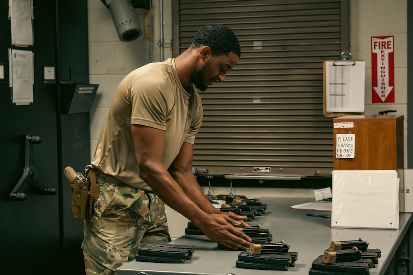 U.S. Air Force Airman 1st Class James Martin, 633rd Security Forces Squadron armorer, organizes ammunition at Joint Base Langley-Eustis, Virginia, Nov 8, 2023. Martin keeps the armory organized in order to ensure the process of signing out firearms and ammo is quick and precise. (U.S. Air Force photo by Airman 1st Class Ian Sullens)