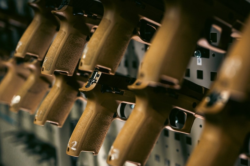 Rows of M18 pistols are stored in the armory at Joint Base Langley-Eustis, Virginia, Nov 8, 2023. The armory secures and accounts for all weapons on the installation to include those used by SFS and weapons owned by military members who reside on base. (U.S. Air Force photo by Airman 1st Class Ian Sullens)