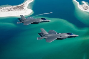 F-35A Lightning IIs assigned to the 95th Fighter Squadron, Tyndall Air Force Base, Fla., fly over the Gulf of Mexico