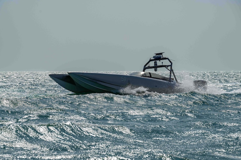 A small boat cruises in open water.