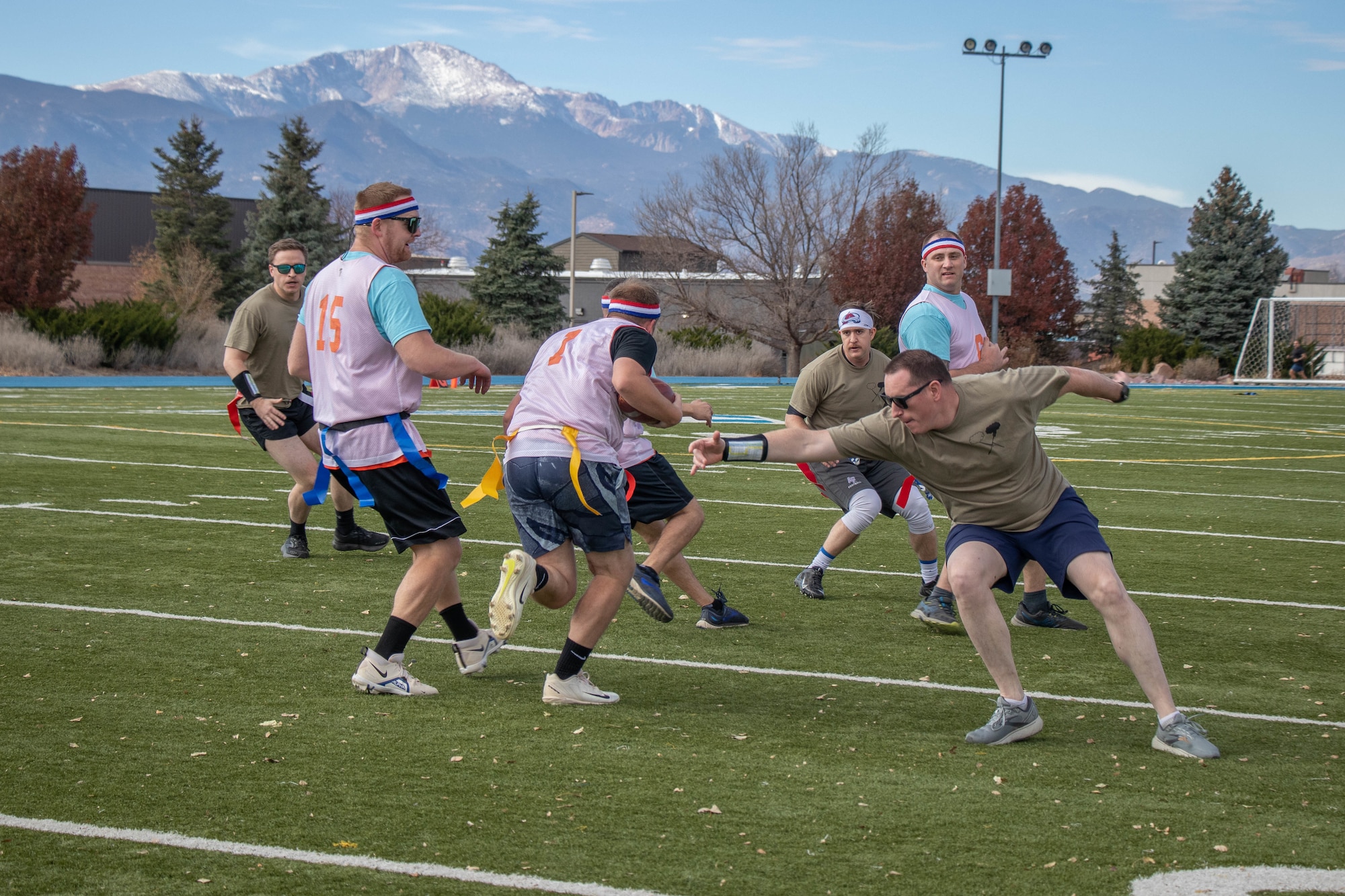 Member from the 23d Electromagnetic Warfare Squadron and the 5th EWS compete in Space Delta 3 – Space Electromagnetic Warfare’s annual Turkey Bowl at Peterson Space Force Base Nov. 16, 2023. While the 5th EWS would win the first game of the day, it was the 4th EWS that would go on to win the annual flag football tournament. (U.S. Space Force photo by Emily Peacock)
