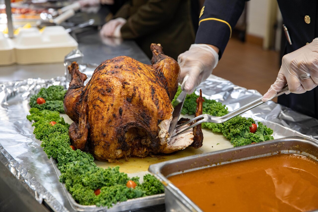 Close-up of a Thanksgiving turkey being carved.