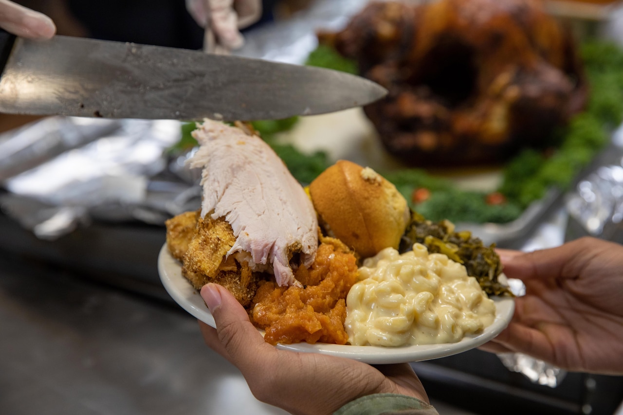 Close-up of a plate of Thanksgiving food.