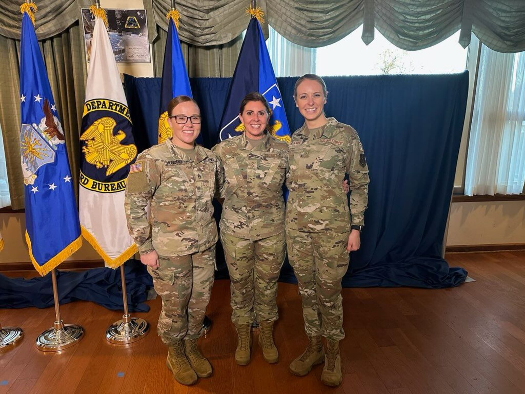 Three Virginia National Guard members pose for photo.