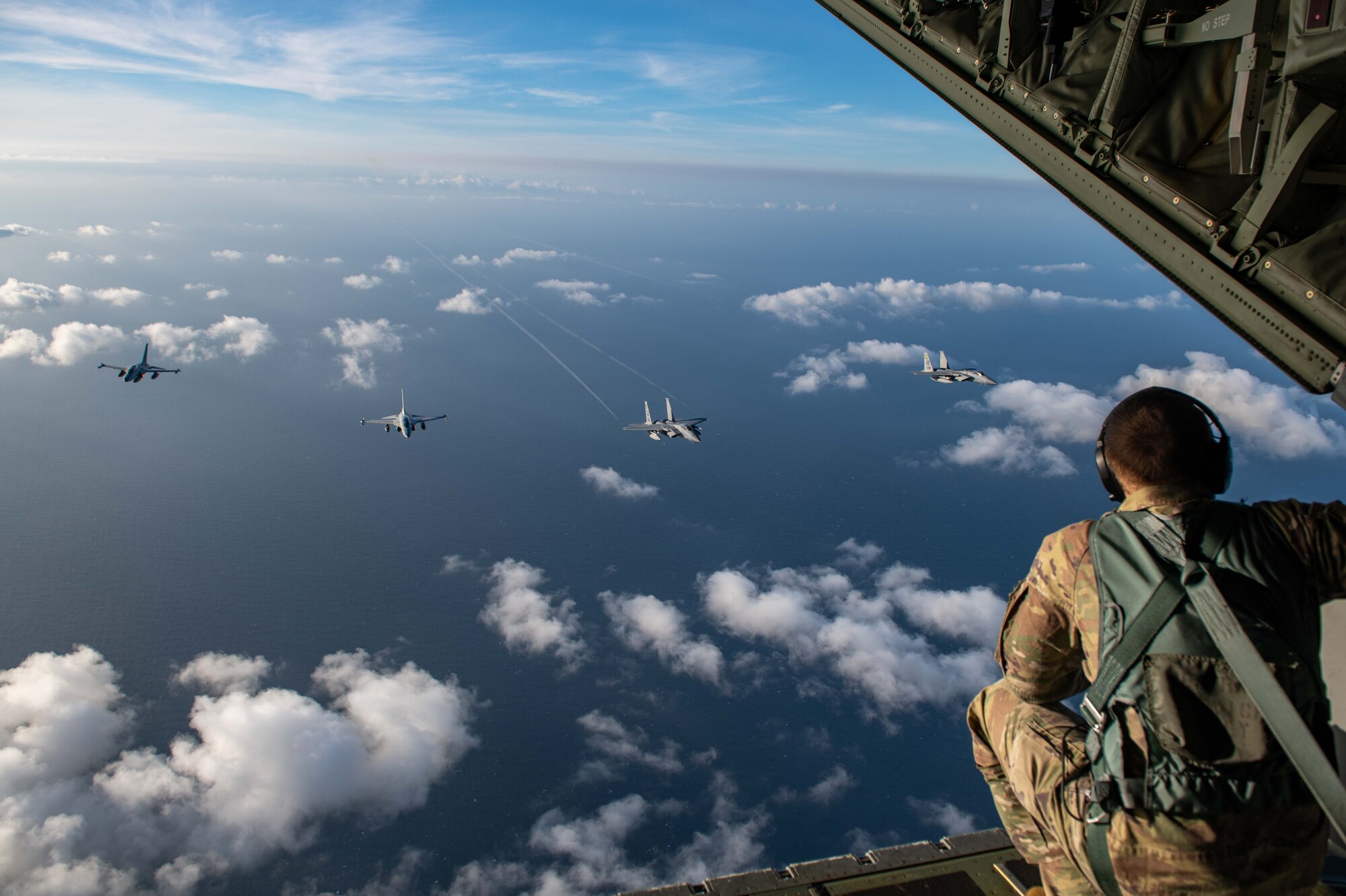 U.S. Air Force F-15s and Philippine Air Force FA-50s fly in formation in the vicinity of the South China Sea in support of a three-day maritime and aerial cooperation activity, Nov. 21-23. The maritime and aerial cooperation activity demonstrates the Armed Forces of the Philippines and U.S. Indo-Pacific Command’s commitment to a free and open Indo-Pacific Region. U.S. forces routinely operate with Allies and partners in defense of the rules-based international order and will continue to do so to maintain peace and stability in the region. (U.S. Air Force photo by Airman 1st Class Alexis Redin)