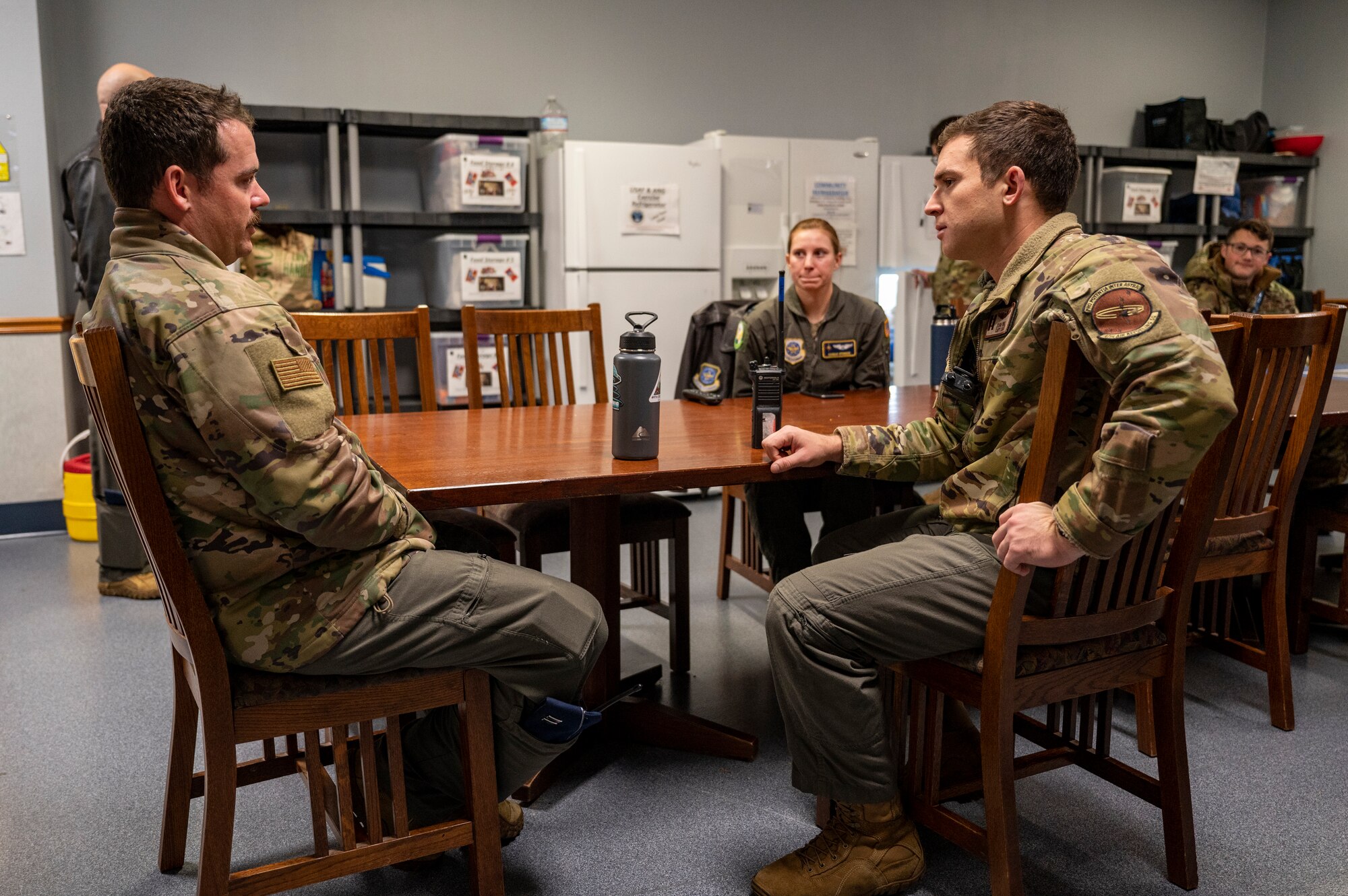 Airmen speak to one another