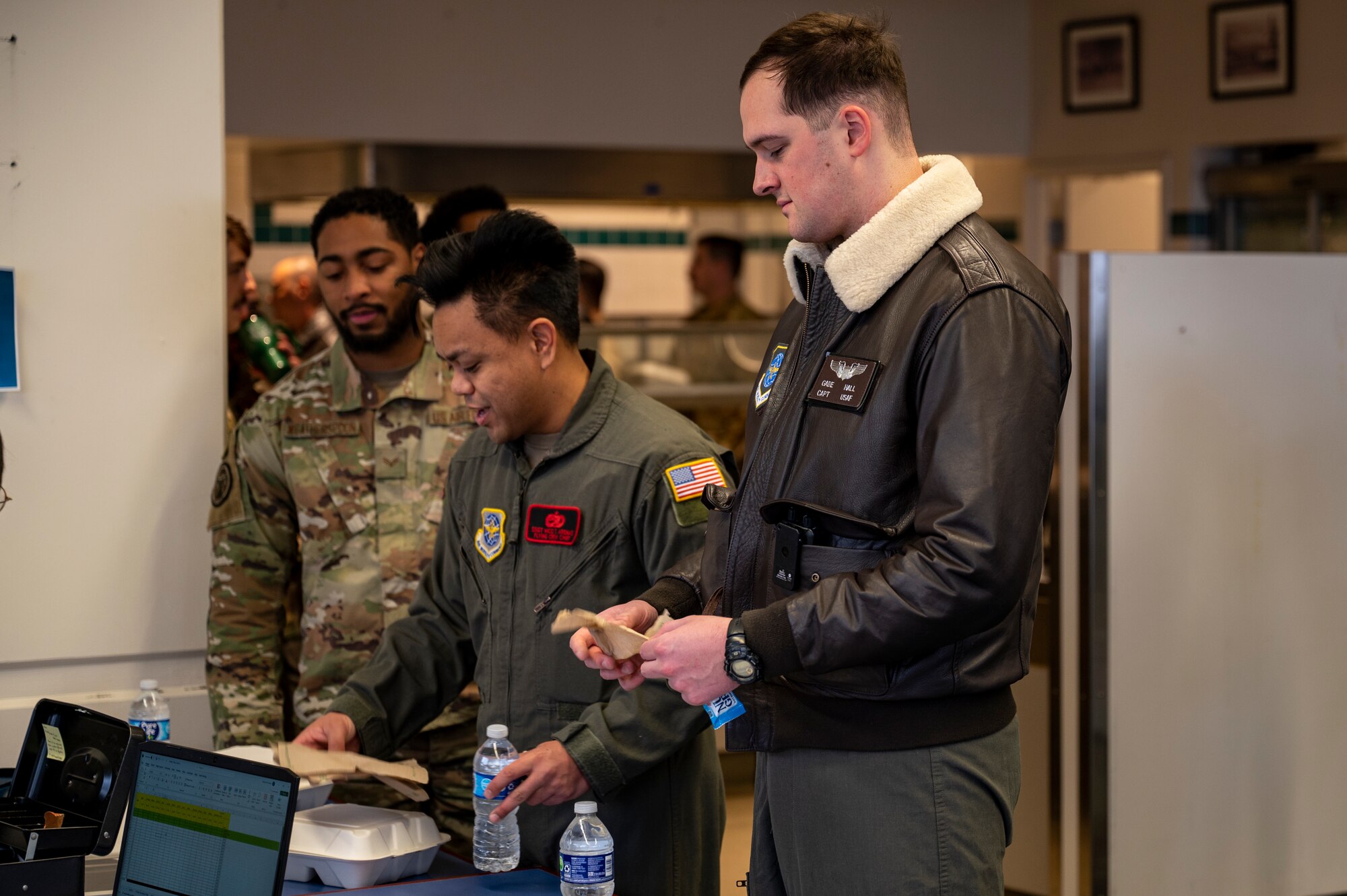 An Airman buys food