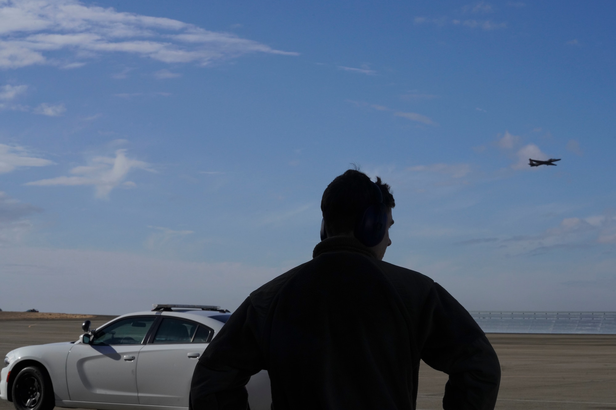 U.S. Air Force 9th Aircraft Maintenance Squadron Airman looks out onto the flightline, Nov. 16, 2023 at Beale Air Force Base, California.