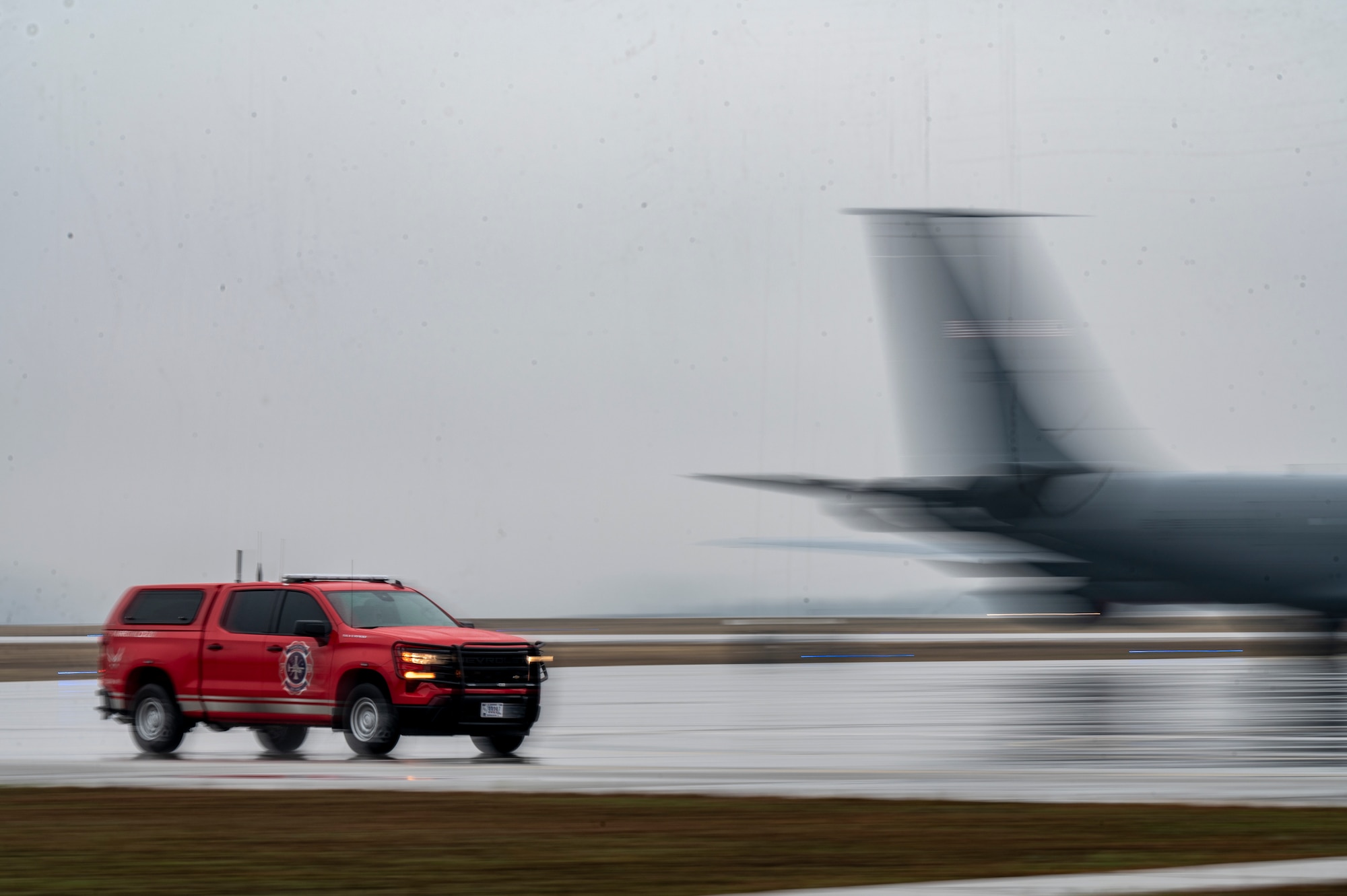 A response vehicle drives on the flightline