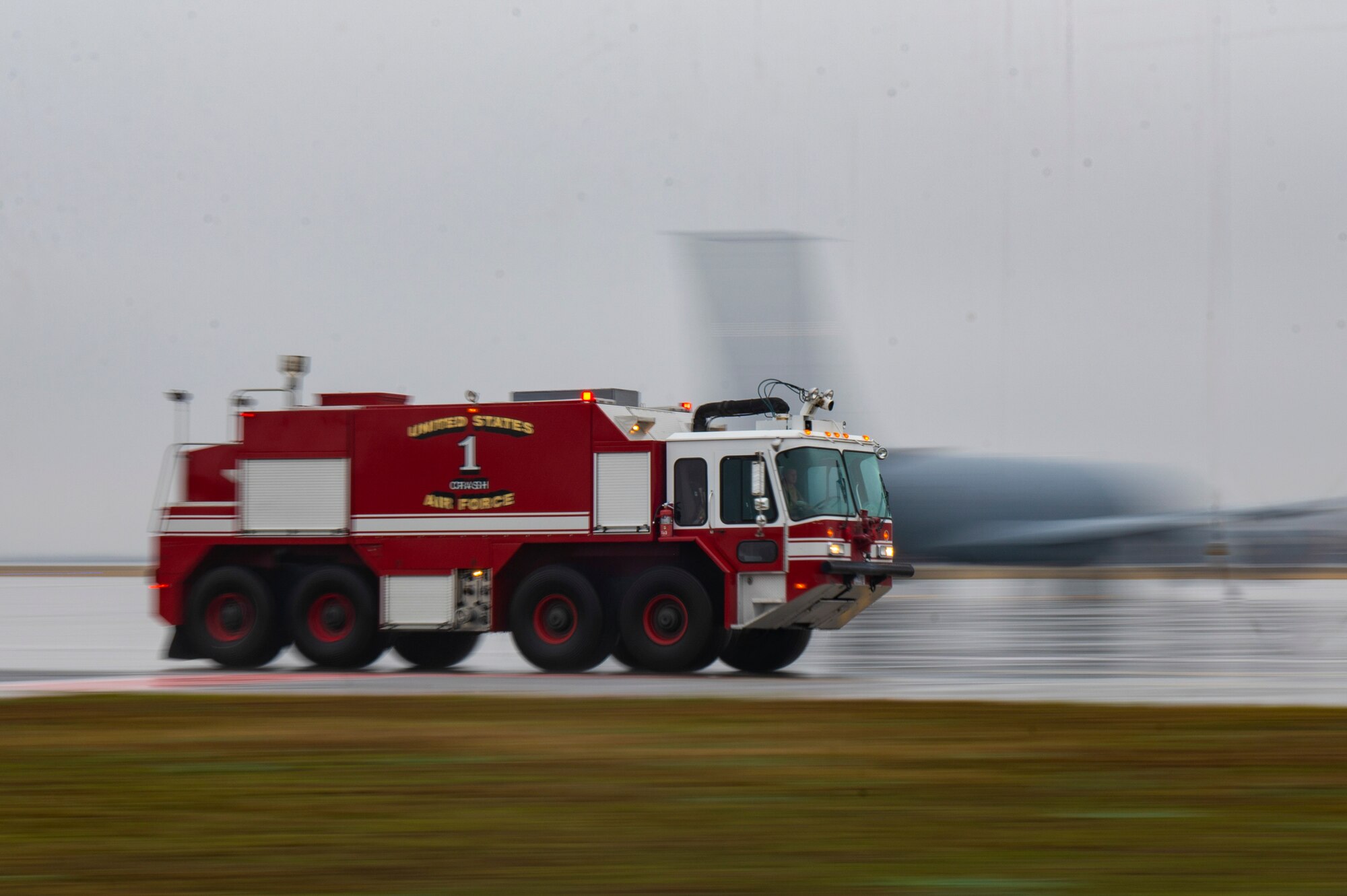 Fire Truck drives on flight line