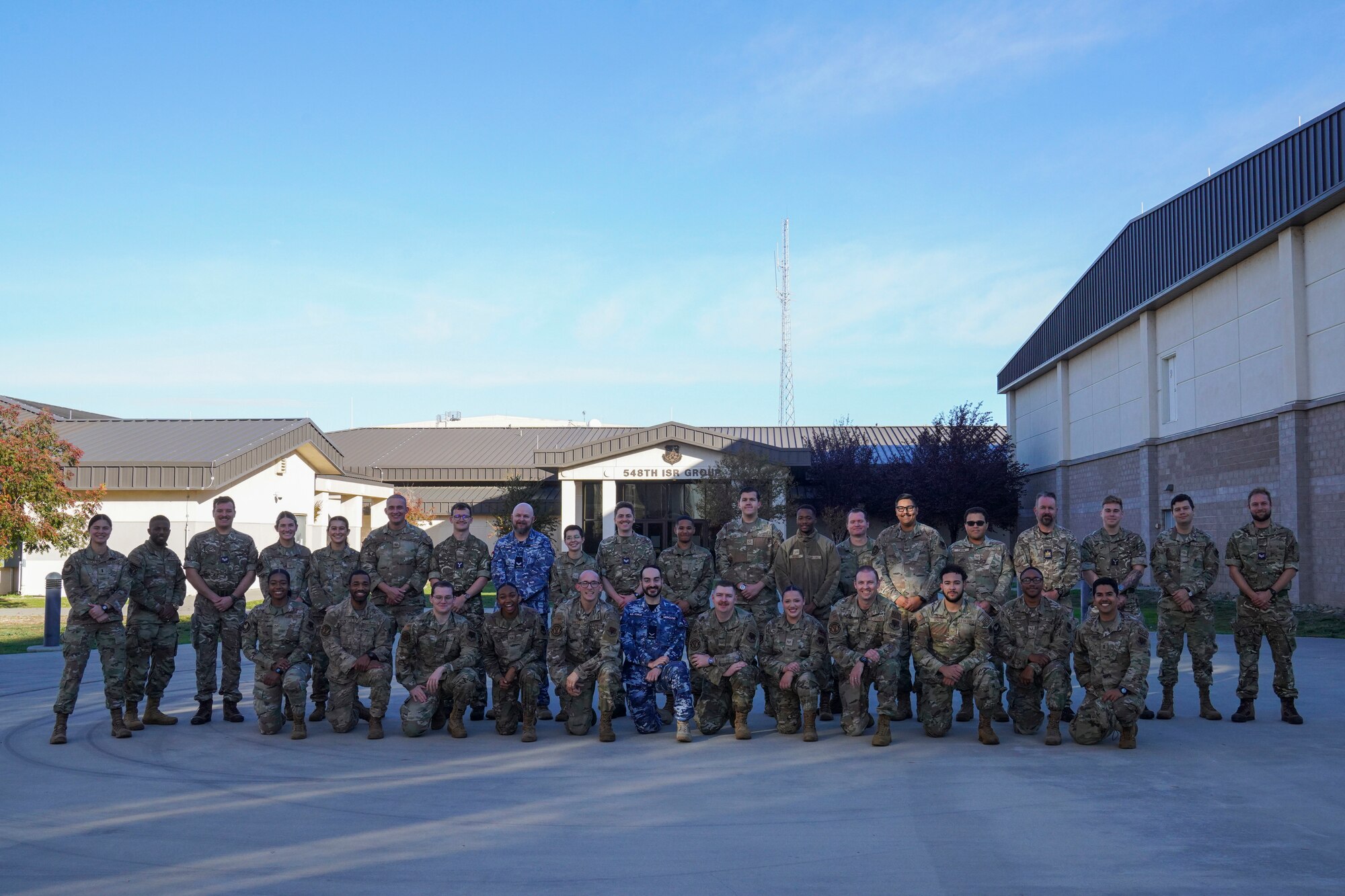 U.S. Air Force 548th Intelligence Surveillance, and Reconnaissance Group (ISRG) Airmen pose for a group photo with members from the Royal Australian Air Force (RAAF) and the Royal Air Force (RAF), Nov. 17, 2023 at Beale Air Force Base, California.