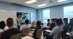 Professor Marvin Young meeting with University of Guam engineering students.