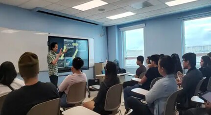 Professor Marvin Young meeting with University of Guam engineering students.