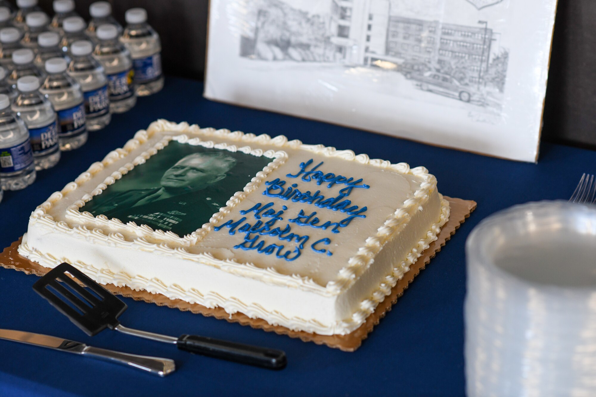 Cake sits on table.