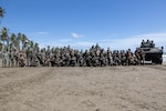 U.S. Marines with Marine Rotational Force-Southeast Asia, I Marine Expeditionary Force, Philippine Marines, 3rd Marine Brigade, service members with Japanese Ground Self-Defense Force, and Royal Marines with Maritime Liaison Assessment Team, 30th Commando Information Exploitation Group, pose for a photo during costal defense training during KAMANDAG 7 in Kamuning beach, Palawan, Philippines, Nov. 16, 2023. KAMANDAG is an annual Philippine Marine Corps and U.S. Marine Corps-led exercise aimed at improving bilateral readiness and mutual capabilities in the advancement of a Free and Open Indo-Pacific. This year marks the seventh iteration of this exercise and includes participants from Japan, the Republic of Korea, and observers from the United Kingdom. MRF-SEA is a Marine Corps Forces Pacific operational model which involves planned exchanges with subject matter experts, promotes security goals with Allies and partners, and positions I MEF forces west of the International Date Line. (U.S. Marine Corps photo by Cpl. Savannah Norris)