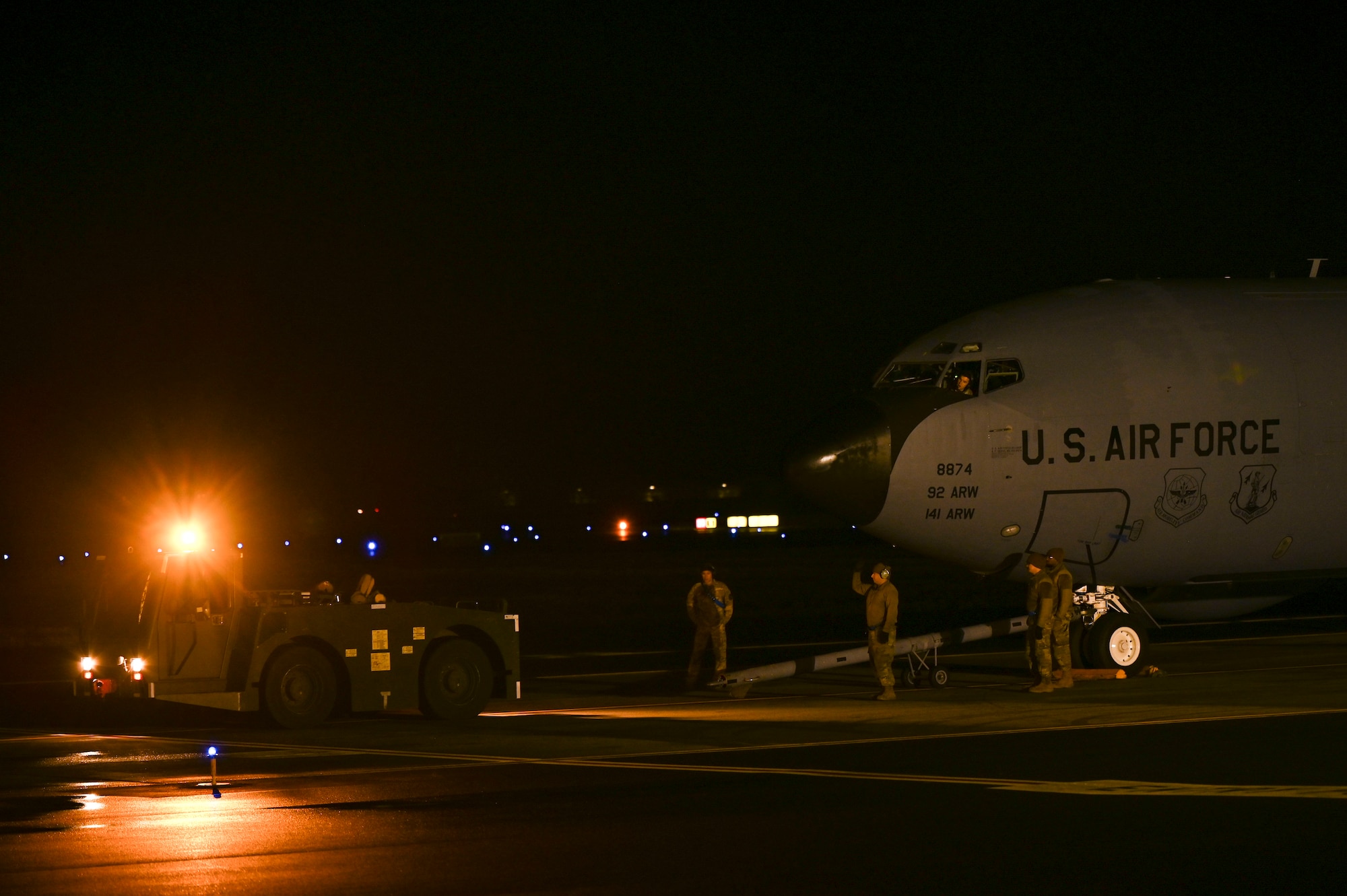 Airmen set up an aircraft to be towed.