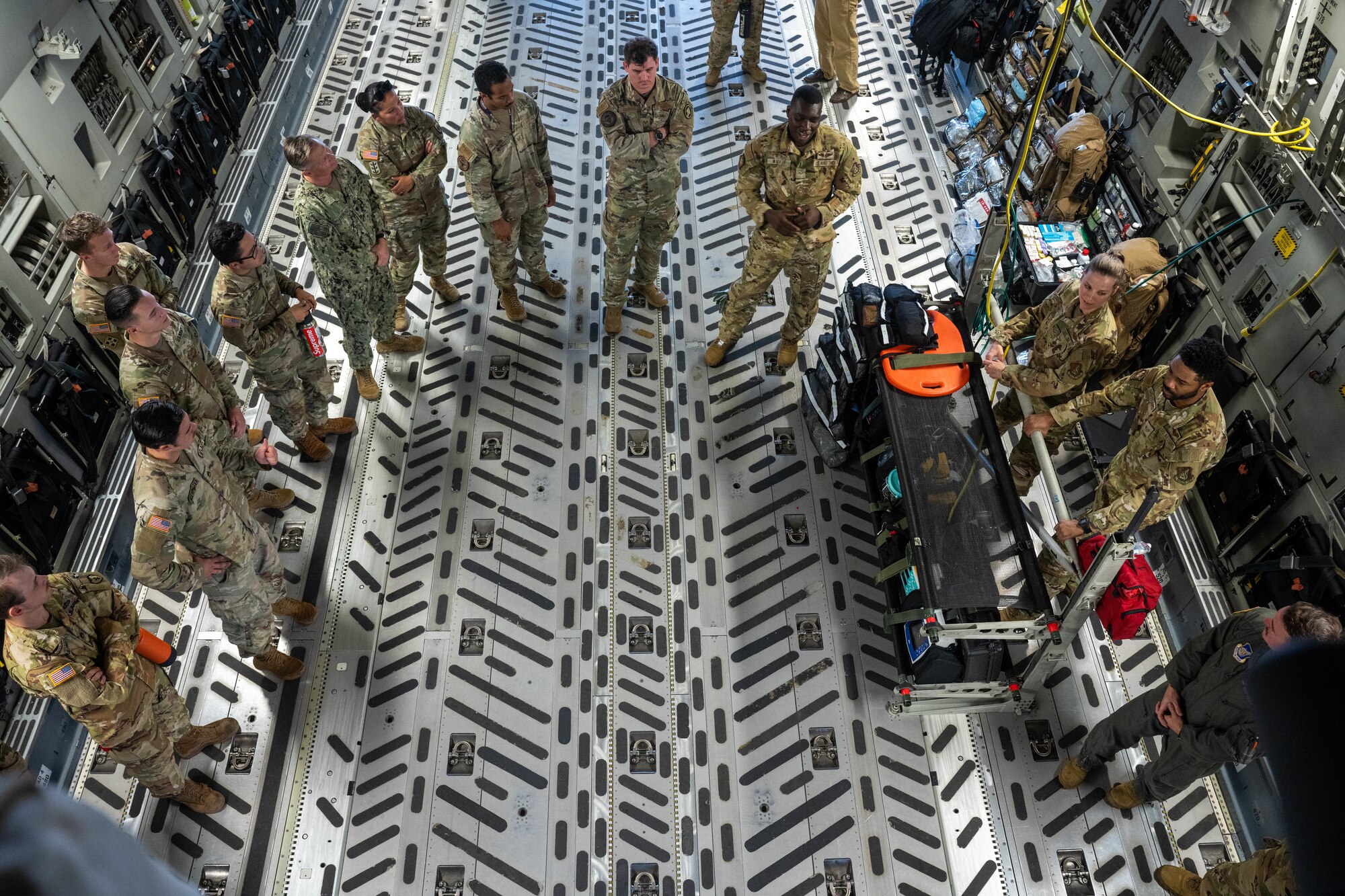 Airmen assigned to the 18th Aeromedical Evacuation Squadron brief medical service members from around the island during an AE showcase at Joint Base Pearl Harbor-Hickam, Hawaii, Nov. 17, 2023. The event highlighted each medical role that is involved with AE and the members discussed how they operate during patient movements. (U.S. Air Force photo by Senior Airman Makensie Cooper)