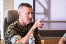 U.S. Marine Corps Brig. Gen. Simon Duran, director, Strategy and Plans Division, Plans, Policies, and Operations (PP&O), Headquarters Marine Corps, discusses community engagement efforts with Marine Corps Base Hawaii leadership and PP&O staff during a visit at Kansas Tower Hill, MCBH, Nov. 16, 2023. PP&O staff visited the base to discuss topics related to training, community engagement, and force modernization. (U.S. Marine Corps photo by Sgt. Brandon Aultman)