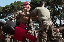 U.S. Marines with Headquarters Battalion (HQBN), Marine Corps Base Hawaii, participate in a pugil stick competition during HQBN’s 1st annual Turkey Bowl, MCBH, Nov. 17, 2023. The HQBN Turkey Bowl is scheduled to be held annually during the Thanksgiving season to foster healthy competition and esprit de corps. (U.S. Marine Corps photo by Cpl. Christian Tofteroo)