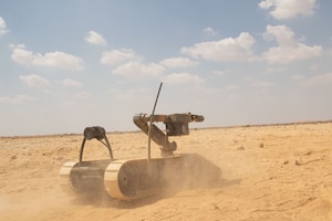 Ground robot moves through sand.