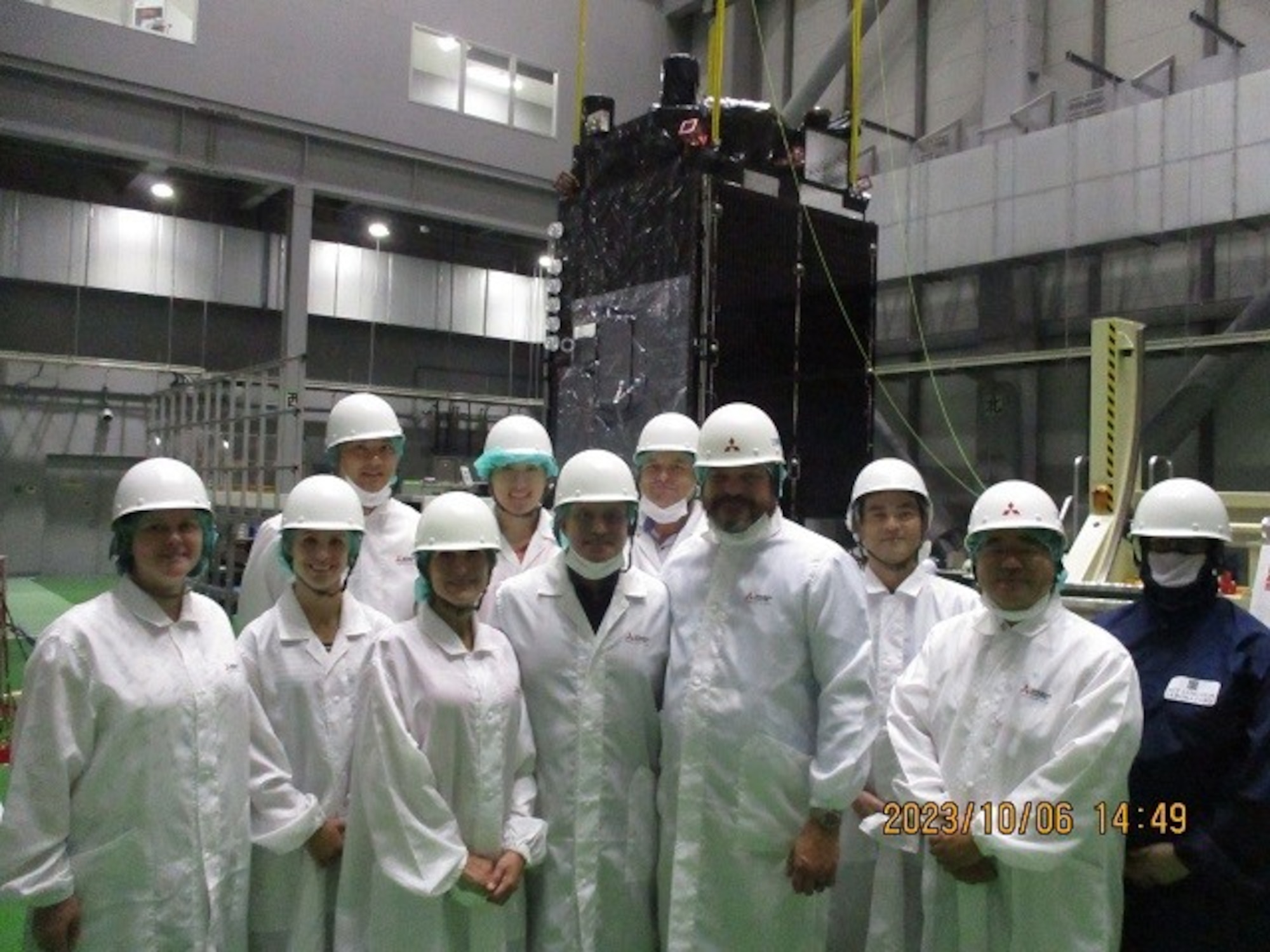 Members from U.S. Space Force’s Space Delta 2-Space Domain Awareness and Space Battle Management, Space Systems Command, and Japan's National Space Policy Secretariat tour the Mitsubishi Electric Corporation facility in Japan, to inspect the Quasi-Zenith Satellite System Oct. 6, 2023. Onboard the QZSS is DEL 2’s Hosted Payload which will provide critical SDA information back to both countries while expanding Japan’s SDA capabilities. (Courtesy photo)