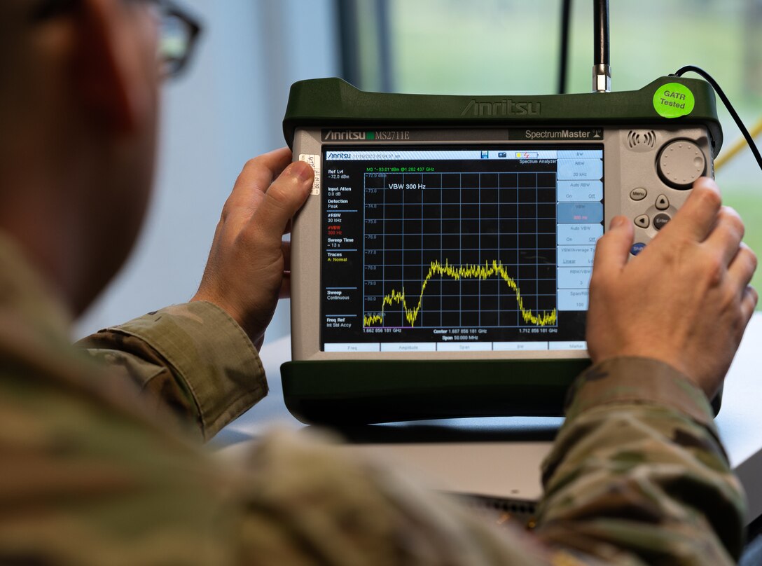 U.S. Space Force Master Sgt. Lane Dorenbusch, 527th Space Aggressor Squadron flight chief of weapons and tactics, observes multiple frequency levels during Exercise HEAVY RAIN 23, Nov. 16, 2023 at Ramstein Air Base, Germany. HEAVY RAIN is a U.S. Air Forces in Europe-led command and control exercise that tests and evaluates communication and data-sharing capabilities among the joint force, NATO Allies and partners. (U.S. Air Force photo by Senior Airman Edgar Grimaldo)