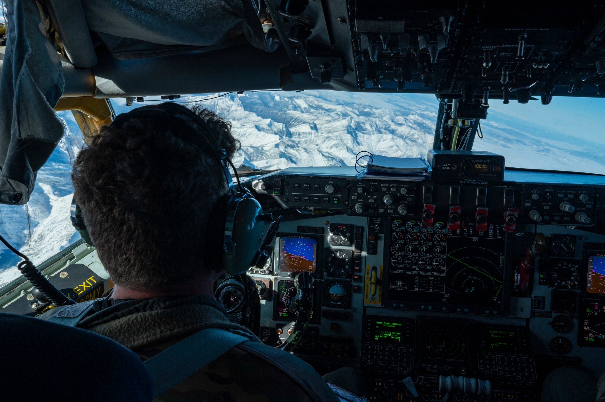 A pilot flies an airplane.