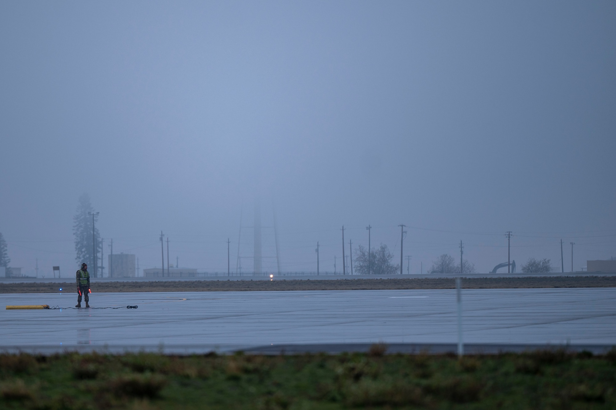 An Airman stands on the flightline.