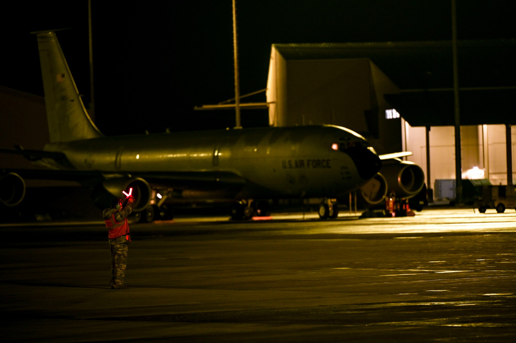An Airman marshals an aircraft on the flightline.