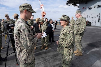 YOKOSUKA, Japan (Nov. 23, 2023) – Chief of Naval Operations Adm. Lisa Franchetti and Master Chief Petty Officer of the Navy James Honea conduct an interview with Stars and Stripes and Armed Forces Network aboard the U.S. Navy's only forward-deployed aircraft carrier USS Ronald Reagan (CVN 76), Nov. 23. Franchetti and Honea visited Reagan and other 7th Fleet commands to engage with Sailors and Navy leadership to highlight Franchetti's priority of strengthening the Navy team. (U.S. Navy photo by Chief Mass Communication Specialist Amanda R. Gray)