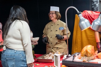 YOKOSUKA, Japan (Nov. 23, 2023) – Chief of Naval Operations Adm. Lisa Franchetti serves Thanksgiving dinner to Sailors aboard the U.S. Navy's only forward-deployed aircraft carrier USS Ronald Reagan (CVN 76), Nov. 23. Franchetti and Master Chief Petty Officer of the Navy James Honea visited Reagan and other 7th Fleet commands to engage with Sailors and Navy leadership to highlight Franchetti's priority of strengthening the Navy team. (U.S. Navy photo by Chief Mass Communication Specialist Amanda R. Gray)