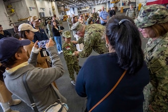 YOKOSUKA, Japan (Nov. 23, 2023) – Master Chief Petty Officer of the Navy James Honea visits with Sailors and their families aboard the U.S. Navy's only forward-deployed aircraft carrier USS Ronald Reagan (CVN 76), Nov. 23. Chief of Naval Operations Adm. Lisa Franchetti and Honea visited Reagan and other 7th Fleet commands to engage with Sailors and Navy leadership to highlight Franchetti's priority of strengthening the Navy team. (U.S. Navy photo by Chief Mass Communication Specialist Amanda R. Gray)