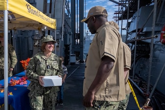 YOKOSUKA, Japan (Nov. 23, 2023) – Chief of Naval Operations Adm. Lisa Franchetti delivers cookies to Sailors aboard the Arleigh Burke-class destroyer USS John Finn (DDG 113), Nov. 23. Franchetti and Master Chief Petty Officer of the Navy James Honea visited John Finn and other 7th Fleet commands to engage with Sailors and Navy leadership to highlight Franchetti's priority of strengthening the Navy team. (U.S. Navy photo by Chief Mass Communication Specialist Amanda R. Gray)