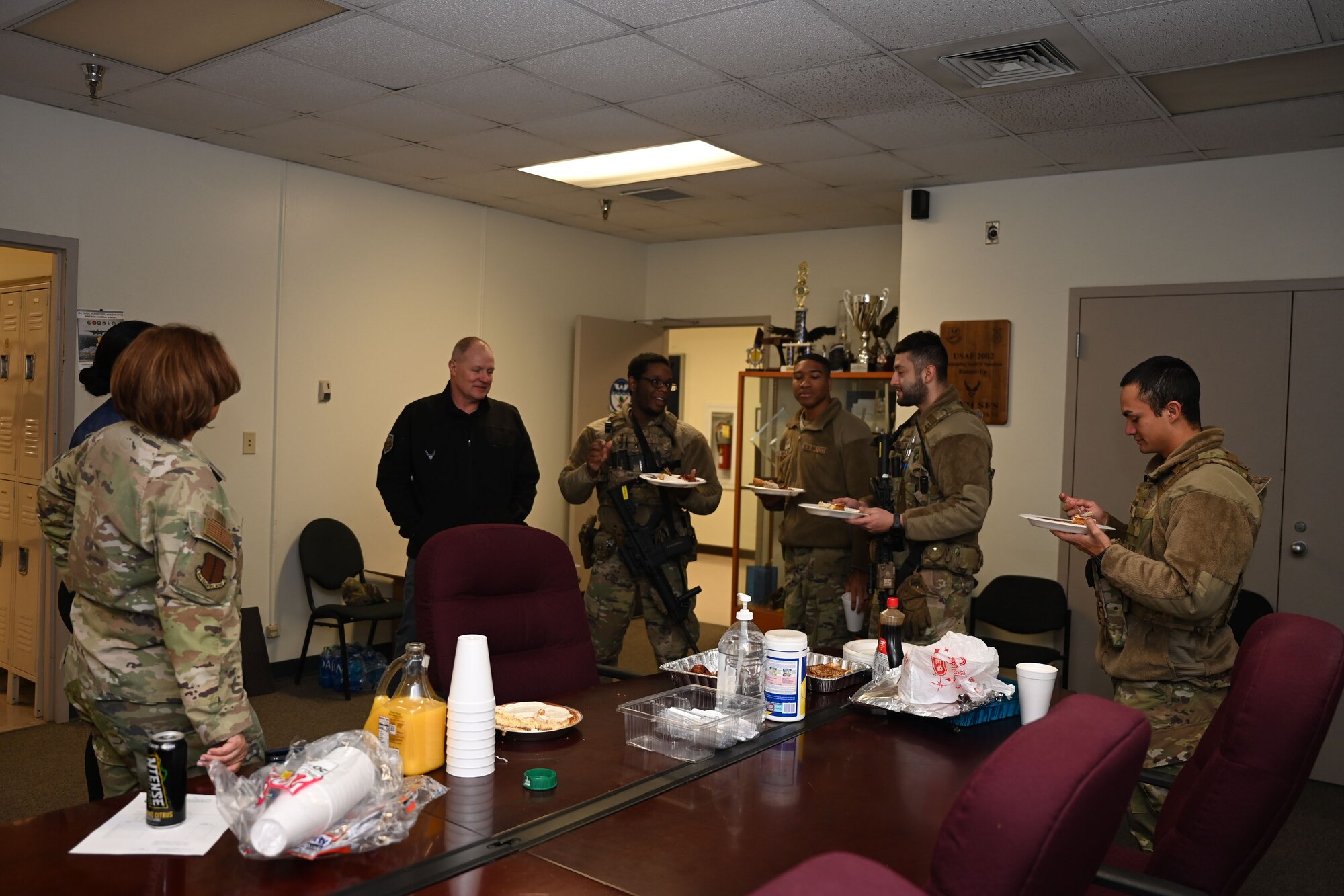 U.S Air Force Col. Angelina Maguinness, 17th Training Wing commander, and Chief Master Sgt. Khammilla Washington, 17th TRW command chief, talks to the 17th Security Forces Squadron Airmen during breakfast on Thanksgiving morning at the 17th SFS building, Goodfellow Air Force Base, Texas, Nov. 23, 2023. The command team showed their support to Goodfellow’s defenders, working hard to support the 17th TRW mission. (U.S. Air Force photo by Airman 1st Class Evelyn D’Errico)