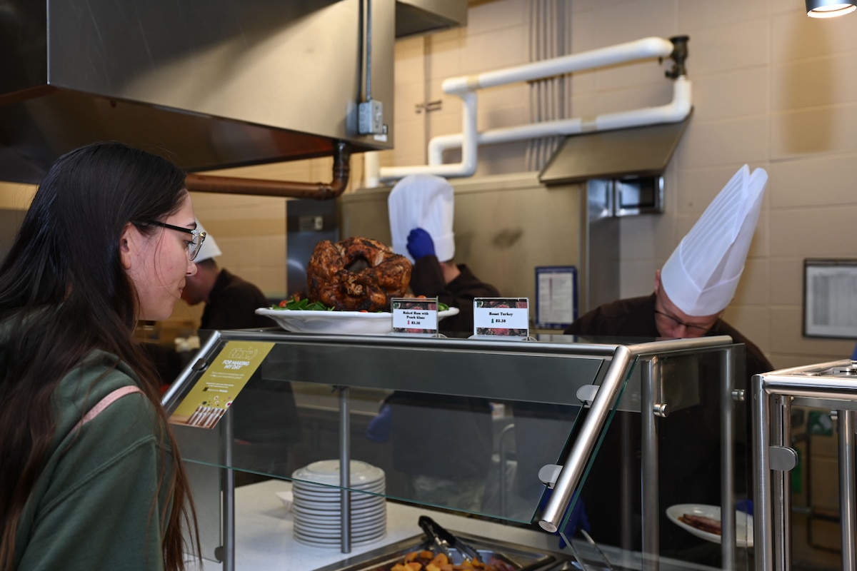 U.S. Air Force Airman Allison Krsak, 17th Training Wing student, waits in line for food during Thanksgiving lunch at the Western Winds Dining Facility, Goodfellow Air Force Base, Texas, Nov. 23, 2023. Leadership asked each member about themselves and thanked them for their service. (U.S. Air Force photo by Airman 1st Class Evelyn J. D’Errico)