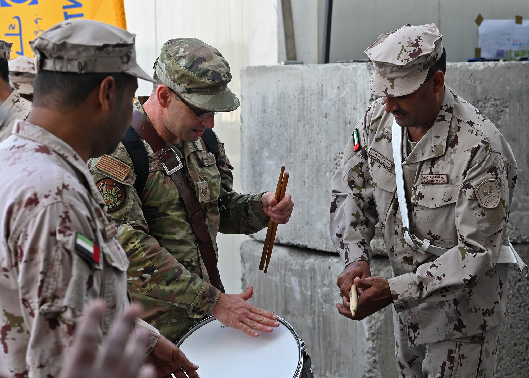 US and UAE band service members interact.