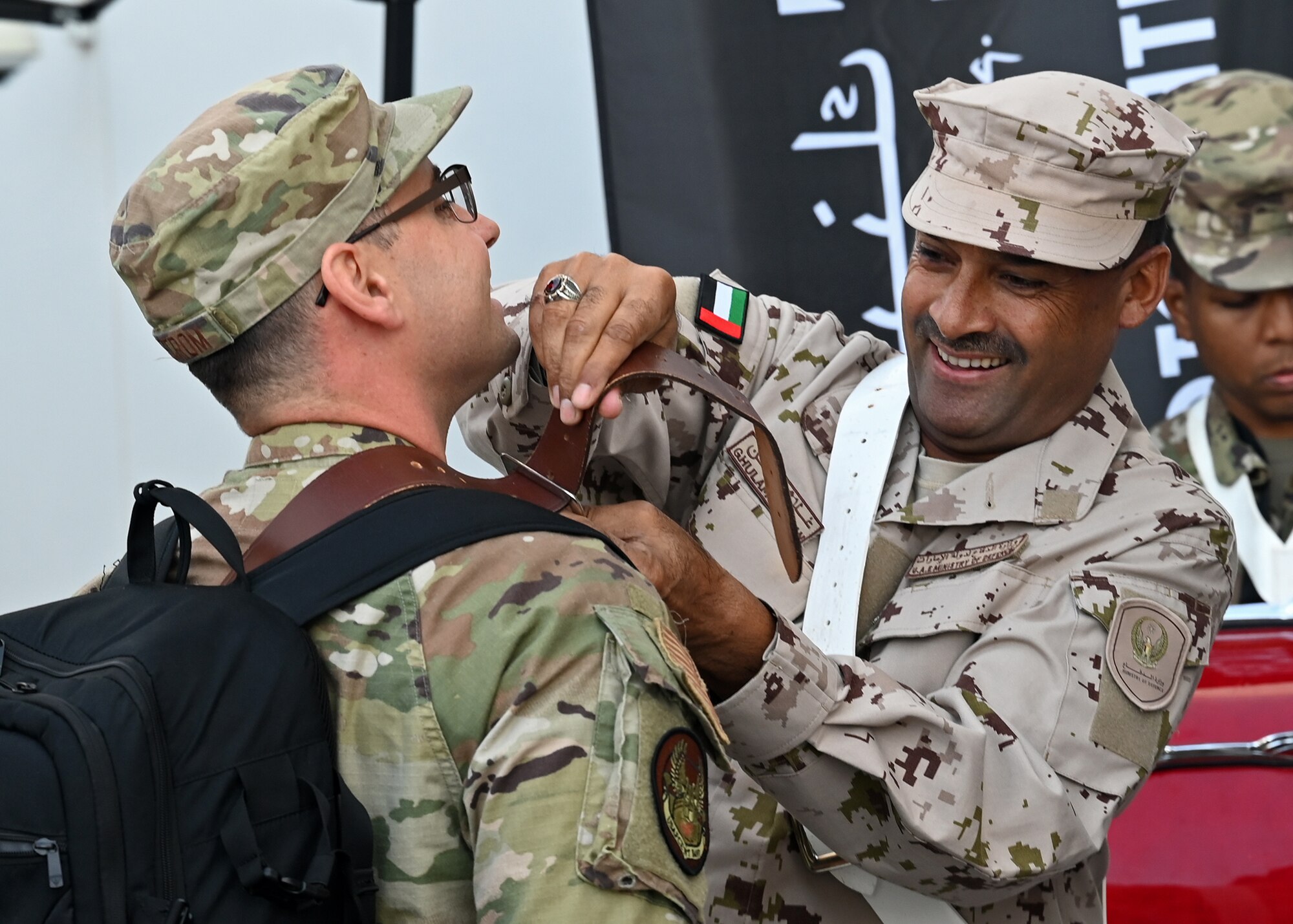 US and UAE band service members interact.