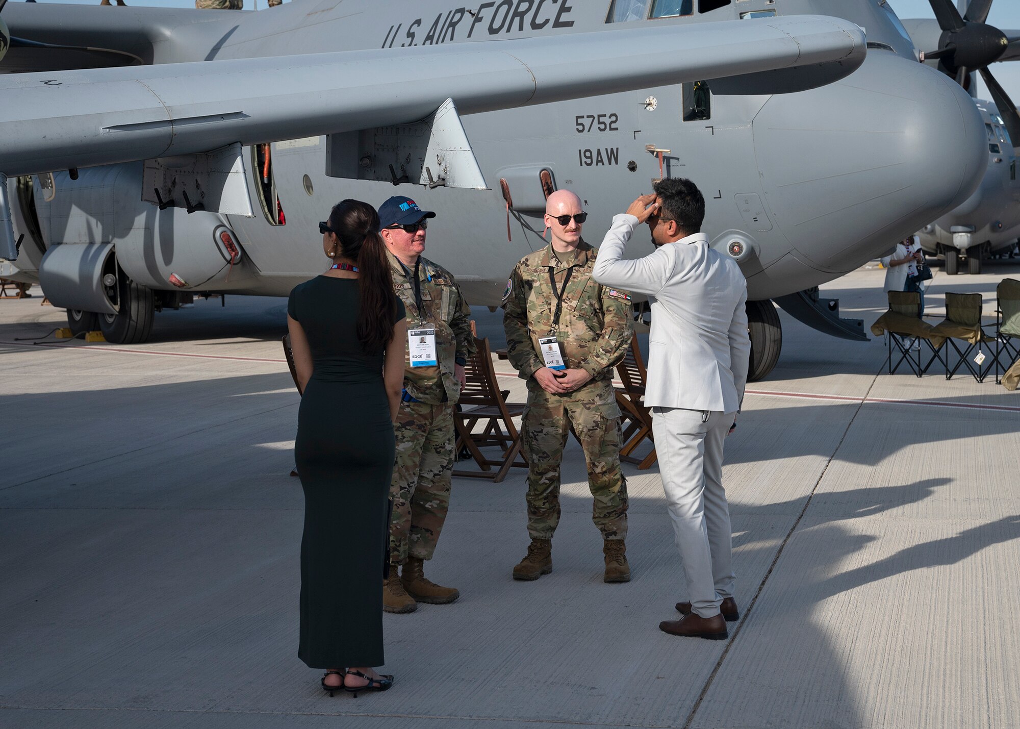 Airmen interact with air show attendees.