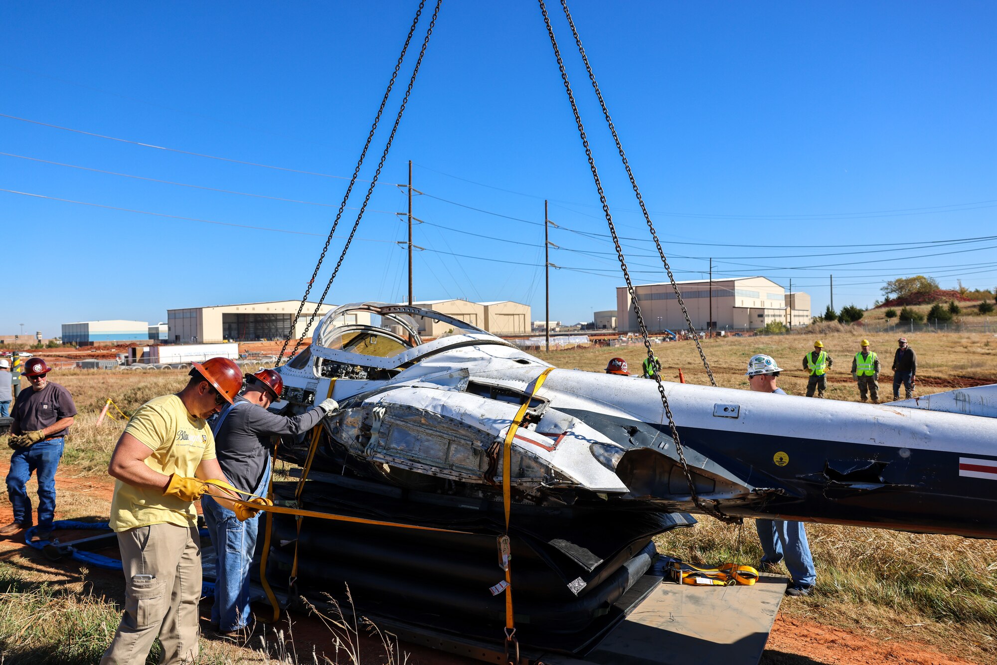 Members from the 552nd Maintenance Group, the 507th Maintenance Group and the 569th Aircraft Maintenance Squadron secure the T-37 Tweet trainer aircraft.