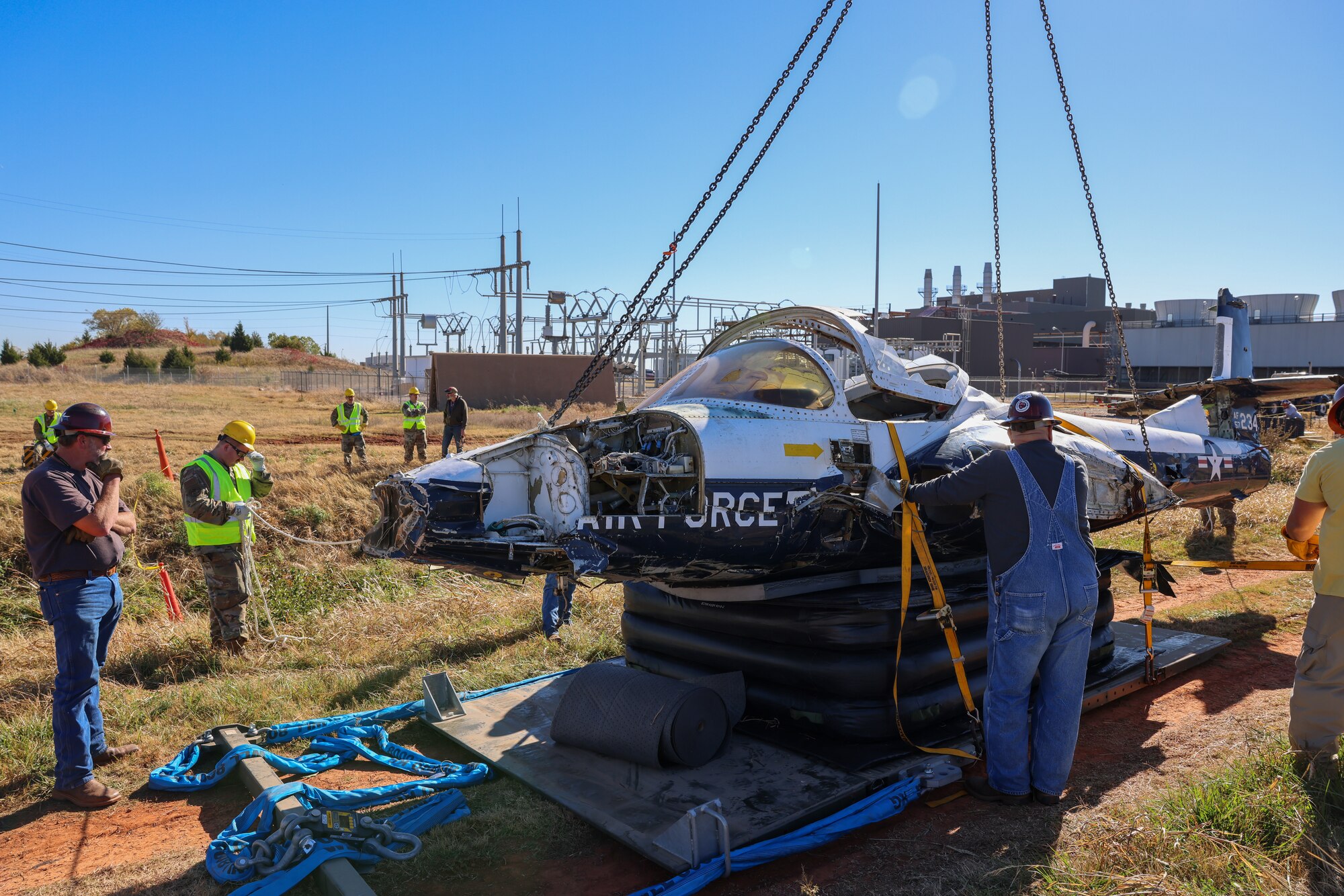 Members from the 552nd Maintenance Group, the 507th Maintenance Group and the 569th Aircraft Maintenance Squadron secure the T-37 Tweet trainer aircraft.