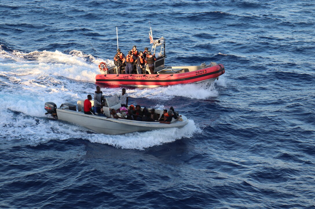 A small boat crew from the U.S. Coast Guard Cutter Legare  interdicts a go-fast vessel with twenty Haitian migrants aboard, Nov. 7, 2023, near Cap-Haïtien, Haiti. Legare patrolled over 11,000 nautical miles in support of Homeland Security Task Force – Southeast and Operation Vigilant Sentry within the Coast Guard Seventh District’s area of responsibility.