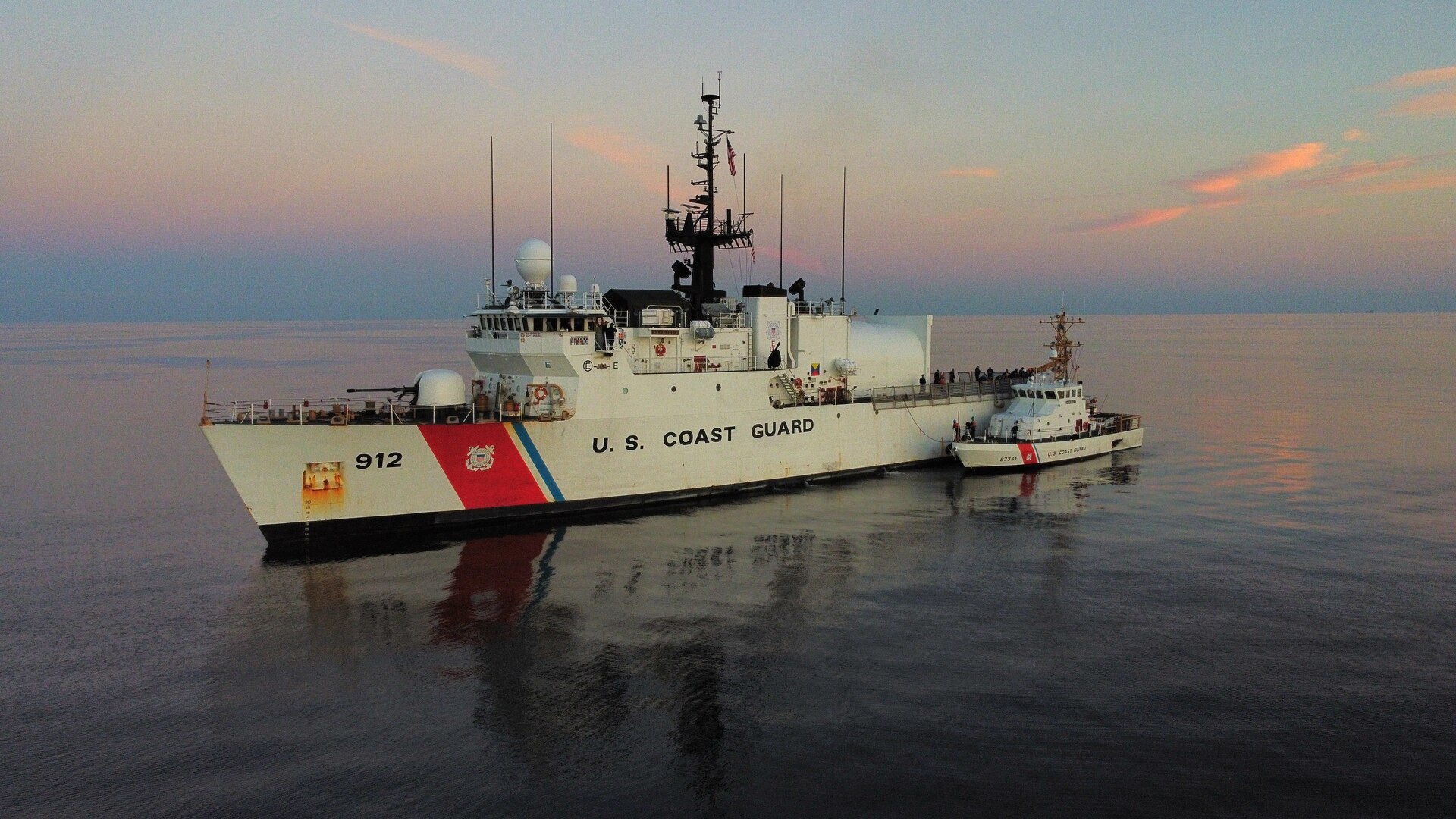 The crews of U.S. Coast Guard Cutter Legare and Coast Guard Cutter Moray conduct a supply replenishment near the mouth of the Mississippi River, Nov. 19, 2023. Legare was patrolling the Gulf of Mexico in response to an oil discharge approximately 20 miles northeast of the mouth of the Mississippi River.