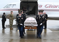 An honor guard from the New Hampshire Army National Guard escorted the body of Staff Sgt. Tanner Grone during an honorable transfer Nov. 22, 2023, at the Army Aviation Support Facility in Concord, N.H.