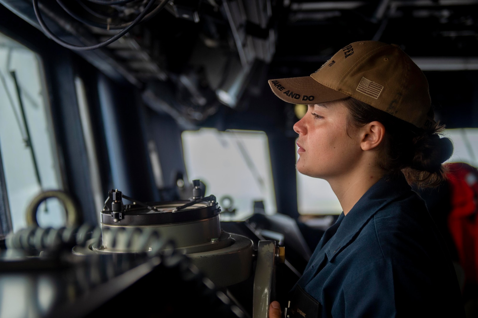 231125-N-EE352-1016 SOUTH CHINA SEA (Nov. 25, 2023) – Ensign Alexandra Urbine, from Philadelphia, Pennsylvania, standing watch as a conning officer in the bridge as the Arleigh Burke-class guided-missile destroyer USS Grace Hopper (DDG 70) conducts routine underway operations. Hopper is forward-deployed to the U.S. 7th Fleet area of operations in support of a free and open Indo-Pacific. (U.S. Navy photo by Mass Communication Specialist 2nd Class Leon Vonguyen)