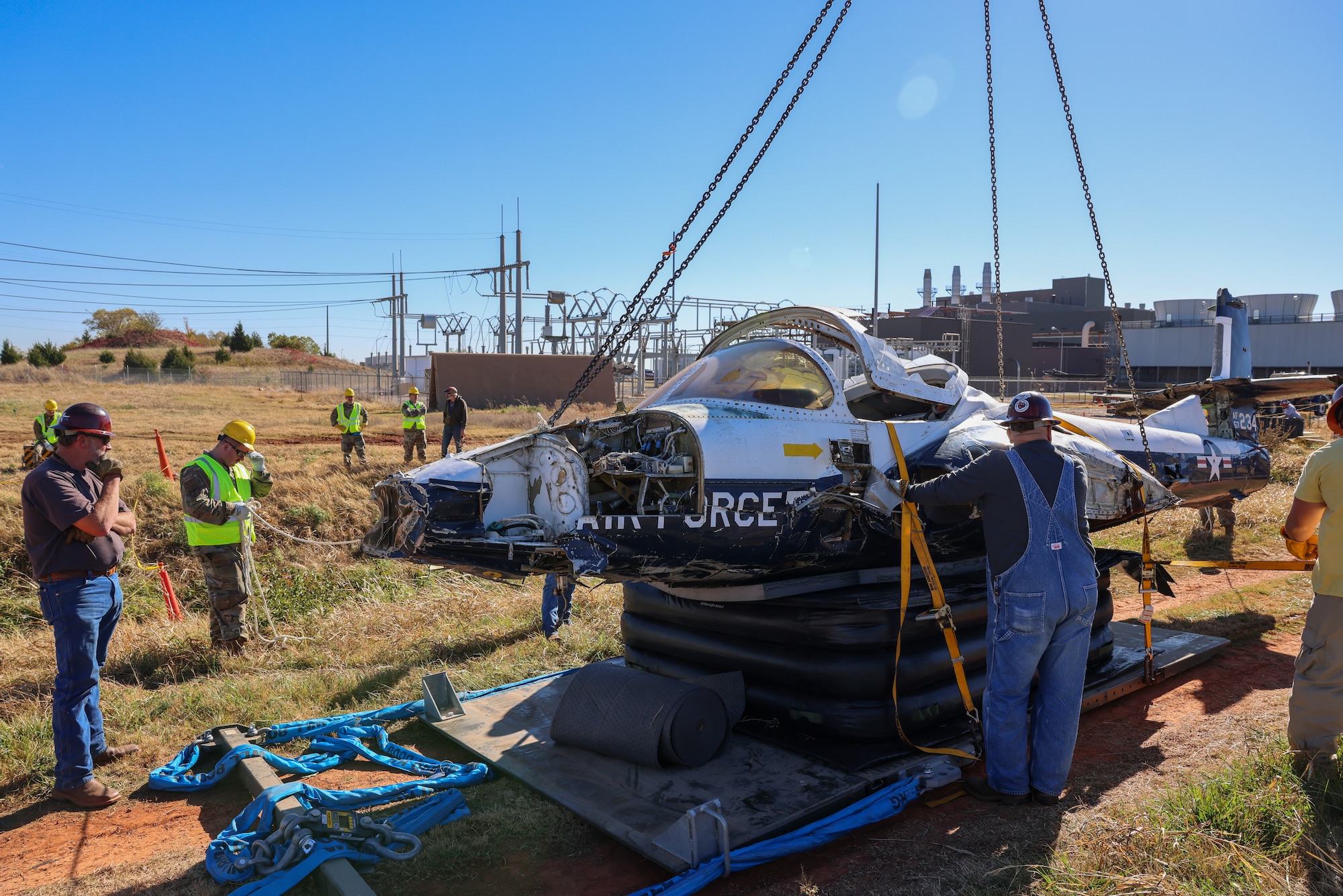 Members from the 552nd Maintenance Group, the 507th Maintenance Group and the 569th Aircraft Maintenance Squadron secure the T-37 Tweet trainer aircraft.