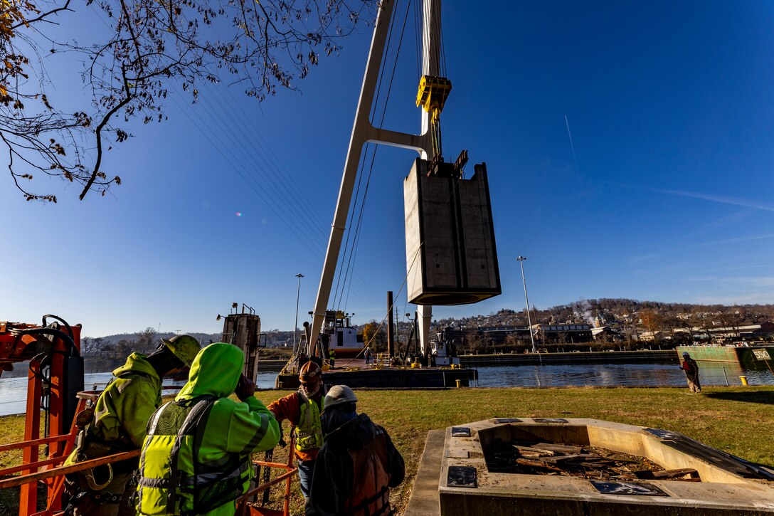 Contractors working for the U.S. Army Corps of Engineers Pittsburgh District install a 23-foot-tall concrete shaft enclosure weighing approximately 120,000 pounds as part of the guard wall at the Monongahela River Locks and Dam 4 in Charleroi, Pennsylvania, Nov. 16, 2023.