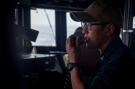 231125-N-EE352-2048
SOUTH CHINA SEA (Nov. 25, 2023) – Boatswain’s Mate 2nd Class Talgat Marks, from Danville, Pennsylvania, makes announcement over the 1MC in the bridge aboard the Arleigh Burke-class guided-missile destroyer USS Hopper (DDG 70) while conducting routine underway operations. Hopper is forward-deployed to the U.S. 7th Fleet area of operations in support of a free and open Indo-Pacific. (U.S. Navy photo by Mass Communication Specialist 2nd Class Leon Vonguyen)