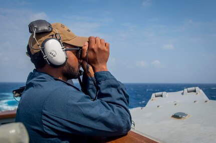 231125-N-EE352-2038
SOUTH CHINA SEA (Nov. 25, 2023) – Boatswain’s Mate Seaman Javon Swain, from Queens, New York, stands watch at the portside bridge lookout aboard the Arleigh Burke-class guided-missile destroyer USS Hopper (DDG 70) while conducting routine underway operations. Hopper is forward-deployed to the U.S. 7th Fleet area of operations in support of a free and open Indo-Pacific. (U.S. Navy photo by Mass Communication Specialist 2nd Class Leon Vonguyen)