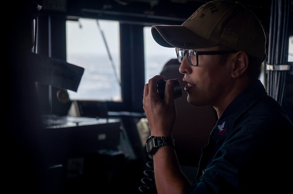 231125-N-EE352-2048
SOUTH CHINA SEA (Nov. 25, 2023) – Boatswain’s Mate 2nd Class Talgat Marks, from Danville, Pennsylvania, makes announcement over the 1MC in the bridge aboard the Arleigh Burke-class guided-missile destroyer USS Hopper (DDG 70) while conducting routine underway operations. Hopper is forward-deployed to the U.S. 7th Fleet area of operations in support of a free and open Indo-Pacific. (U.S. Navy photo by Mass Communication Specialist 2nd Class Leon Vonguyen)